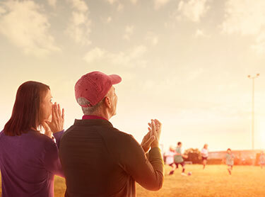 Hero image of soccer game spectators clapping